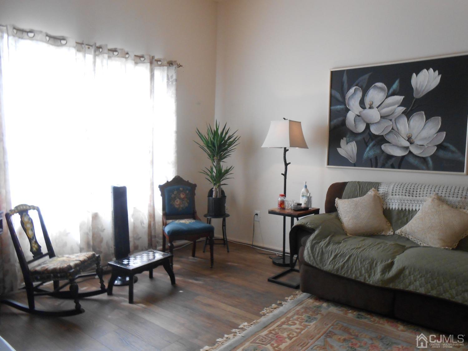 93 Pheasant Run Edison, NJ 08820 - Photo 4 of 24 a living room with furniture and a large window