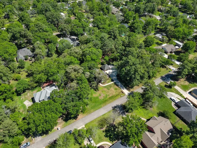 a huge green field with lots of trees