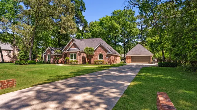 a front view of a house with a yard and porch