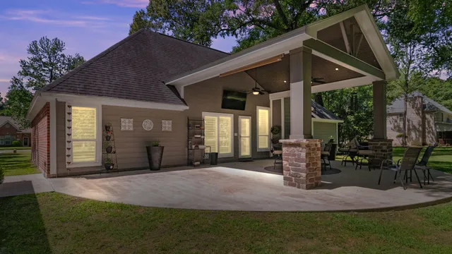 a front view of a house with yard and green space