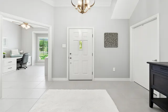 a big house with a big yard and large trees