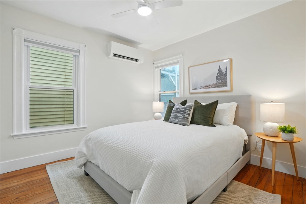 65 Eustis Street, Unit 2 Cambridge, MA 02140 - Photo 7 of 11 a bedroom with a bed and wooden floor
