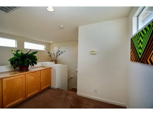 a view of a hallway with potted plant