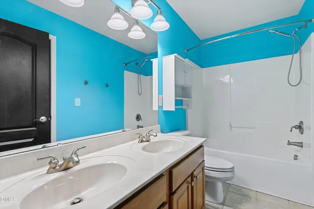 a backyard of a house with outdoor seating