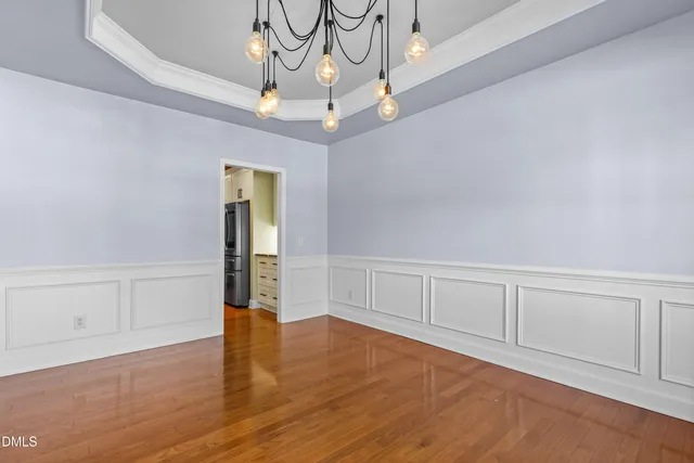a kitchen with granite countertop stainless steel appliances and wooden cabinets