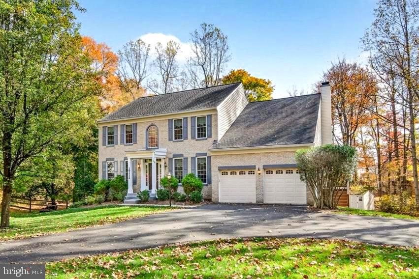 19332 Cissel Manor Drive Poolesville, MD 20837 - Photo 1 of 81 a view of a house with a yard and street