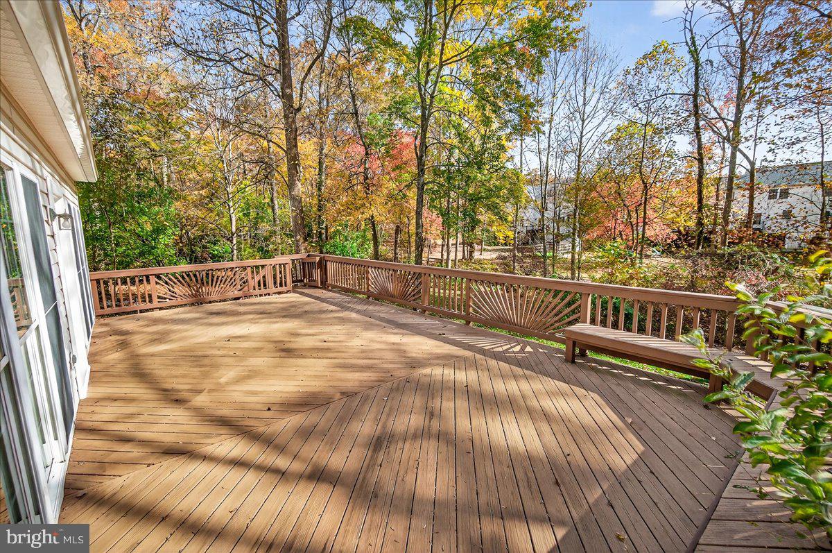 19332 Cissel Manor Drive Poolesville, MD 20837 - Photo 16 of 81 a view of balcony with wooden floor and fence