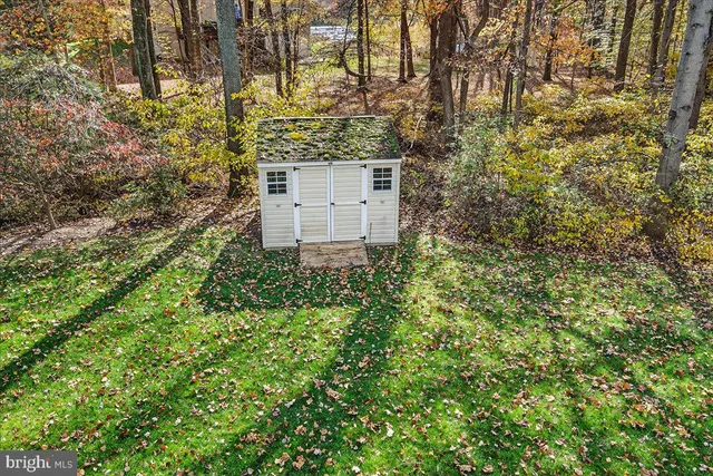 a kitchen with stainless steel appliances wooden floors and wooden cabinets