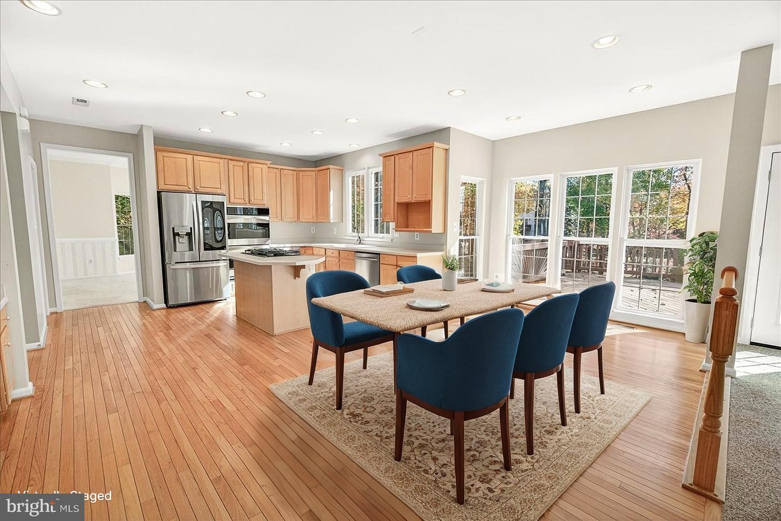 19332 Cissel Manor Drive Poolesville, MD 20837 - Photo 28 of 81 a view of a dining room with furniture window and wooden floor