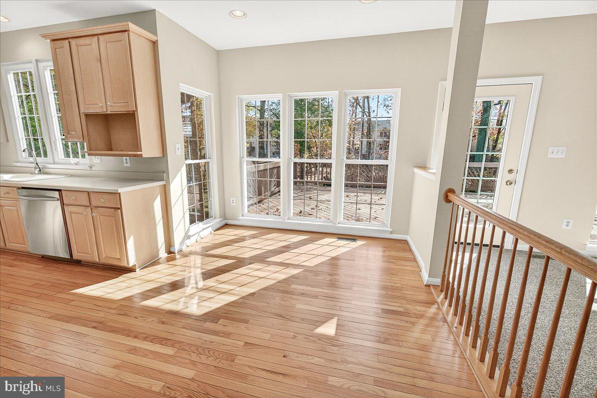 19332 Cissel Manor Drive Poolesville, MD 20837 - Photo 31 of 81 a view of an empty room with wooden floor and a window