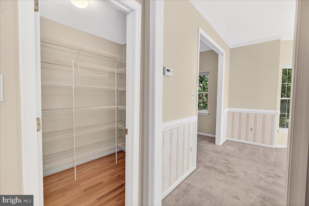 19332 Cissel Manor Drive Poolesville, MD 20837 - Photo 34 of 81 a view of a room with wooden floor and windows