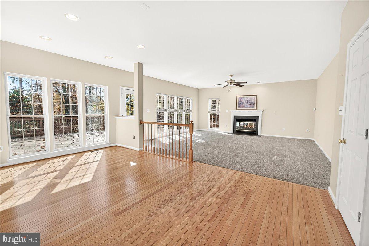 19332 Cissel Manor Drive Poolesville, MD 20837 - Photo 37 of 81 a view of a livingroom with furniture and wooden floor