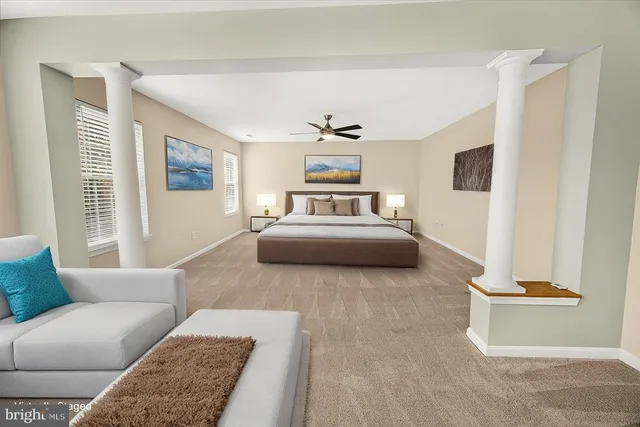 an aerial view of a house with outdoor space and a garden