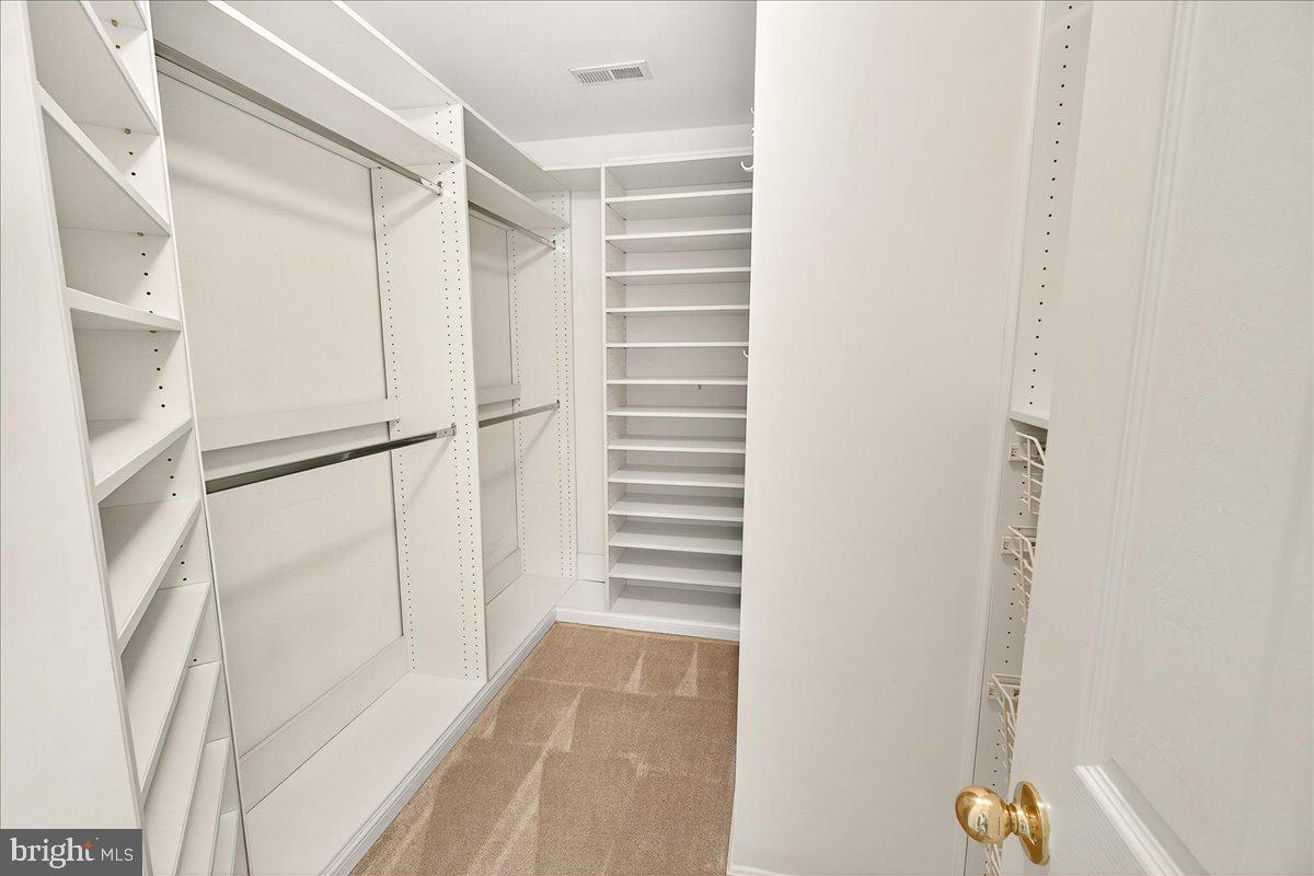 19332 Cissel Manor Drive Poolesville, MD 20837 - Photo 48 of 81 a view of walk in closet with empty racks