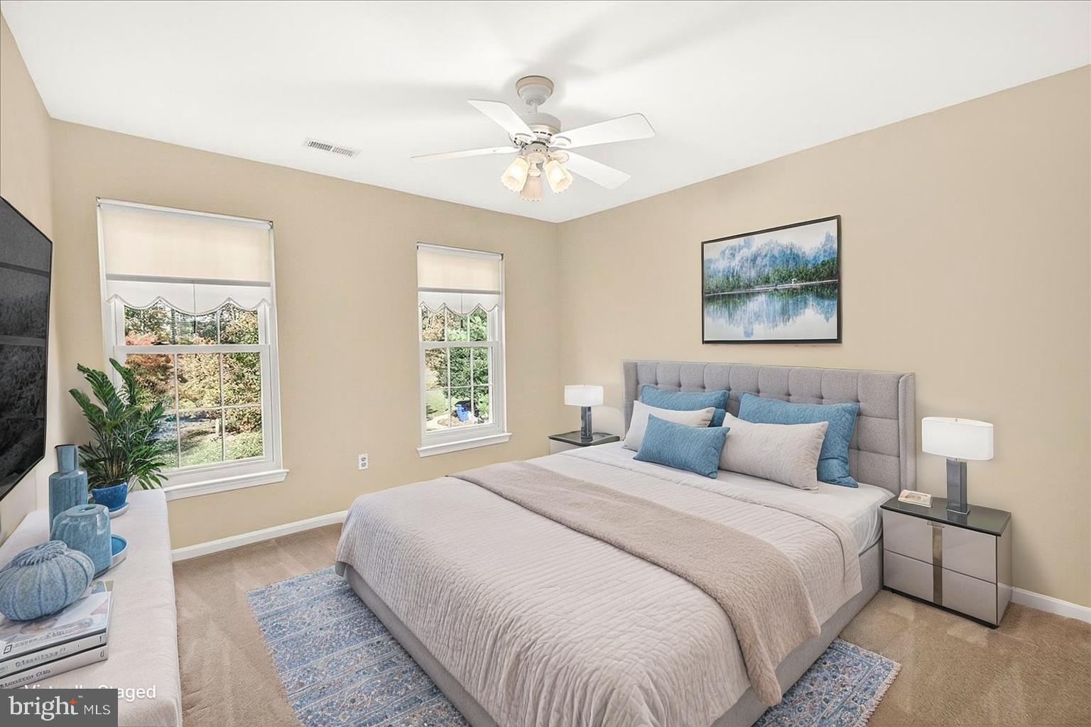 19332 Cissel Manor Drive Poolesville, MD 20837 - Photo 50 of 81 a bedroom with a large bed and a chandelier