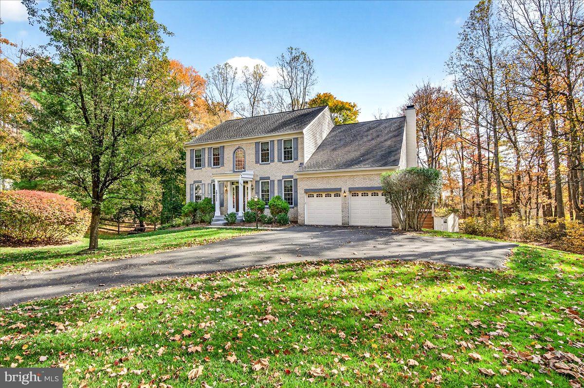 19332 Cissel Manor Drive Poolesville, MD 20837 - Photo 5 of 81 a view of a house with a yard and pathway