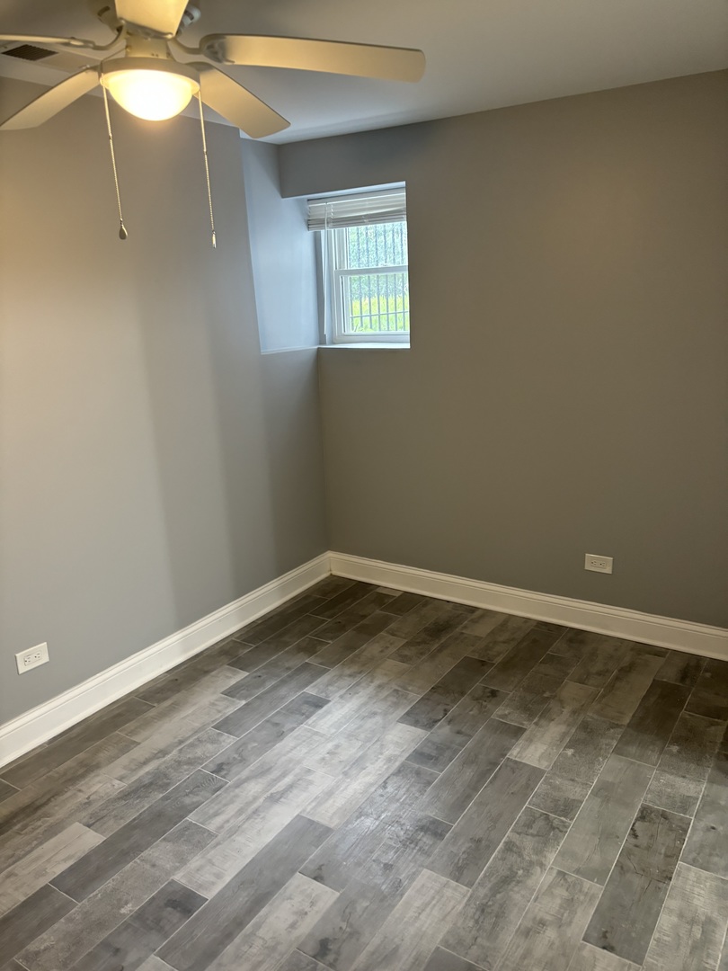 1611 South Trumbull Avenue, Unit G Chicago, IL 60623 - Photo 5 of 9 a view of an empty room