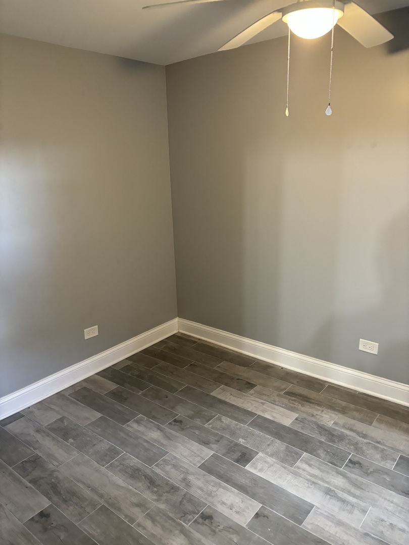 1611 South Trumbull Avenue, Unit G Chicago, IL 60623 - Photo 6 of 9 a view of an empty room