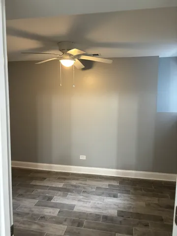 a view of kitchen with refrigerator and window