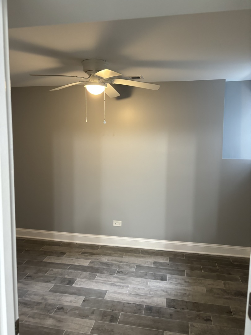 1611 South Trumbull Avenue, Unit G Chicago, IL 60623 - Photo 7 of 9 a view of a room with an empty space