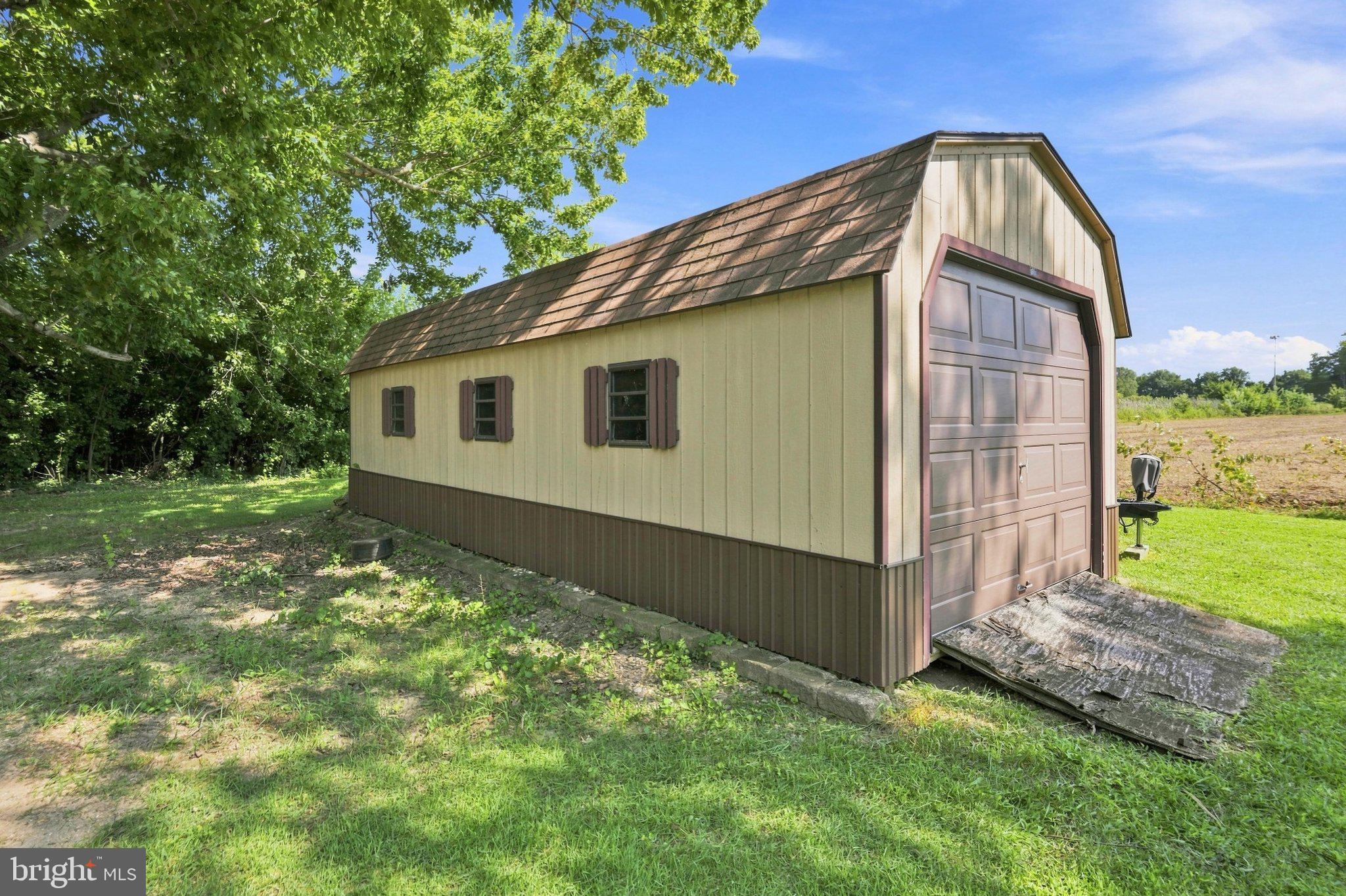 19 South Tilbury Road Salem, NJ 08079 - Photo 25 of 25 Charming storage shed in serene setting.