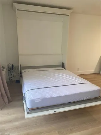 a bedroom with a bed and a shower