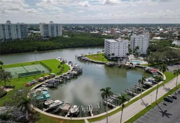 an aerial view of a house with a lake view