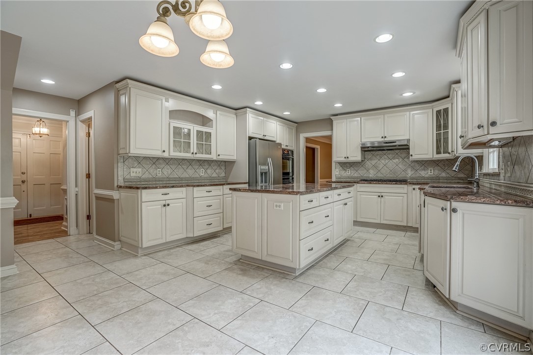 4051 Falstone Road Richmond, VA 23234 - Photo 15 of 50 a large white kitchen with a white cabinets