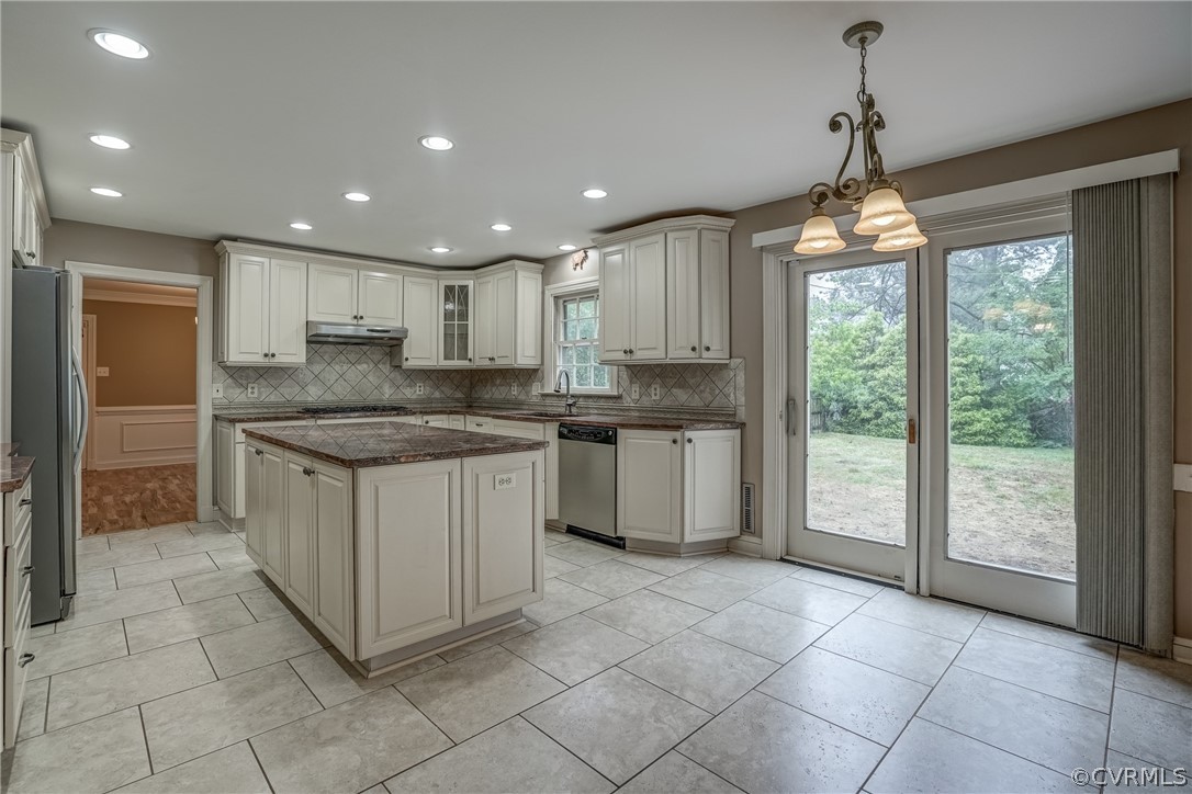 4051 Falstone Road Richmond, VA 23234 - Photo 16 of 50 a kitchen with a stove sink and cabinets
