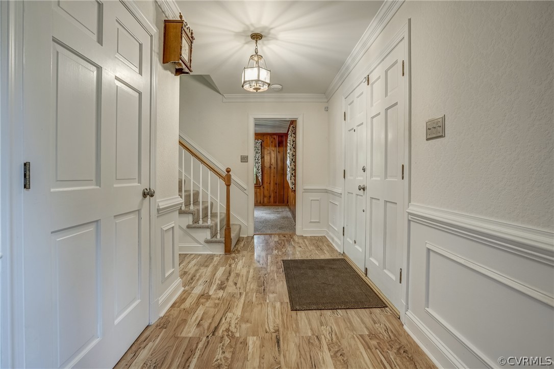 4051 Falstone Road Richmond, VA 23234 - Photo 2 of 50 a view of a hallway with wooden floor and staircase