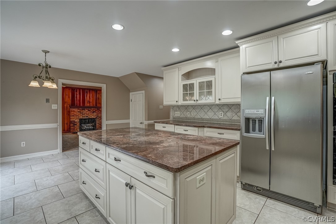 4051 Falstone Road Richmond, VA 23234 - Photo 22 of 50 a kitchen with a refrigerator a sink and cabinets