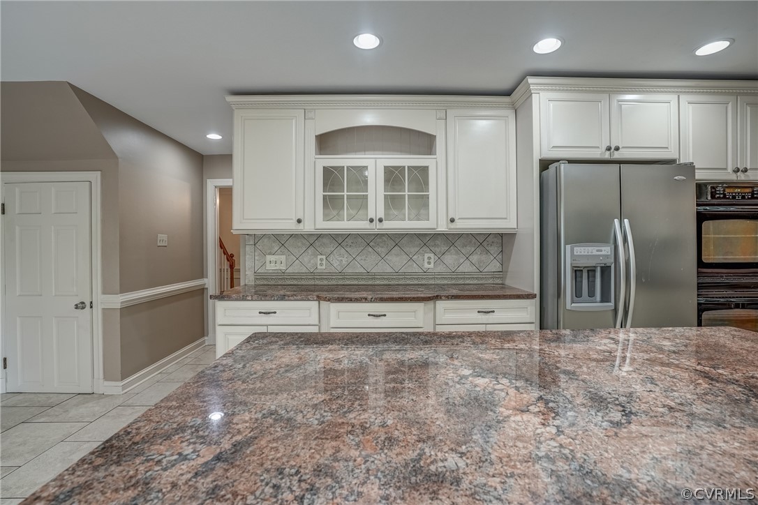 4051 Falstone Road Richmond, VA 23234 - Photo 23 of 50 a kitchen with stainless steel appliances granite countertop a refrigerator and a sink