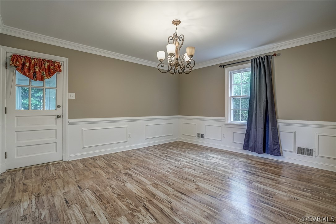 4051 Falstone Road Richmond, VA 23234 - Photo 24 of 50 a view of an empty room with a window and wooden floor