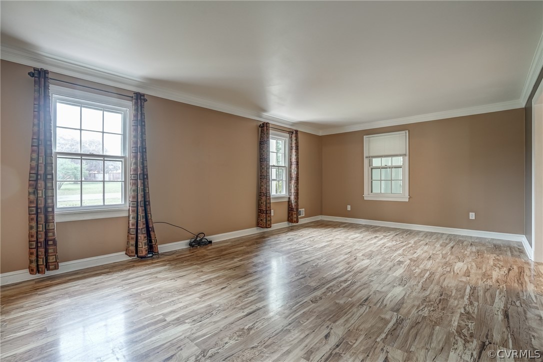 4051 Falstone Road Richmond, VA 23234 - Photo 27 of 50 a view of an empty room with wooden floor and a window