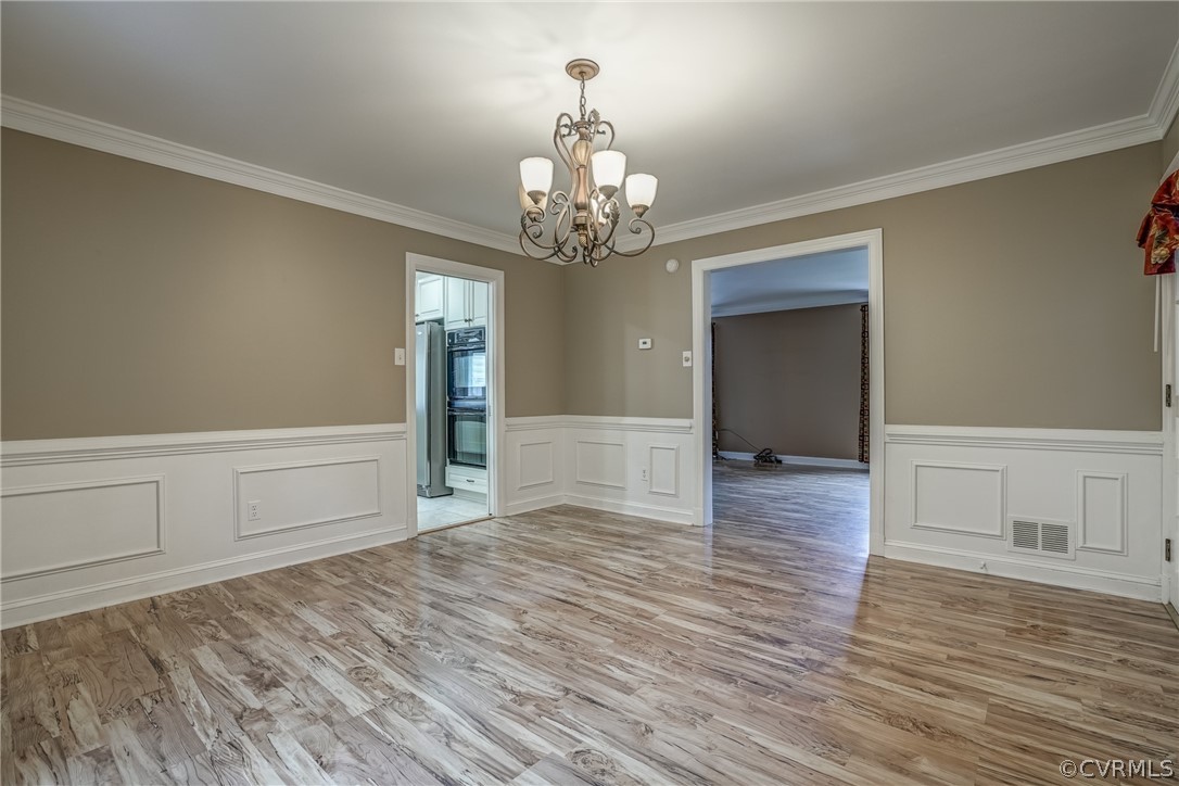 4051 Falstone Road Richmond, VA 23234 - Photo 28 of 50 a view of an empty room with window and wooden floor