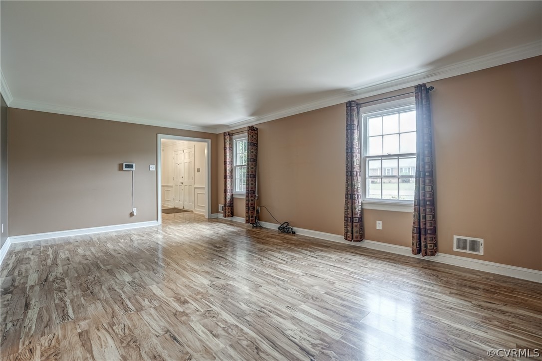 4051 Falstone Road Richmond, VA 23234 - Photo 30 of 50 a view of an empty room with wooden floor and a window
