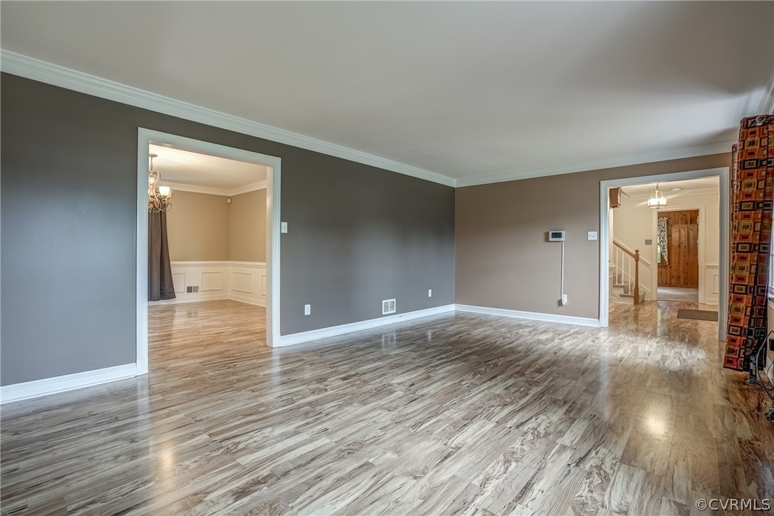 4051 Falstone Road Richmond, VA 23234 - Photo 31 of 50 a view of a hallway with wooden floor and a bathroom