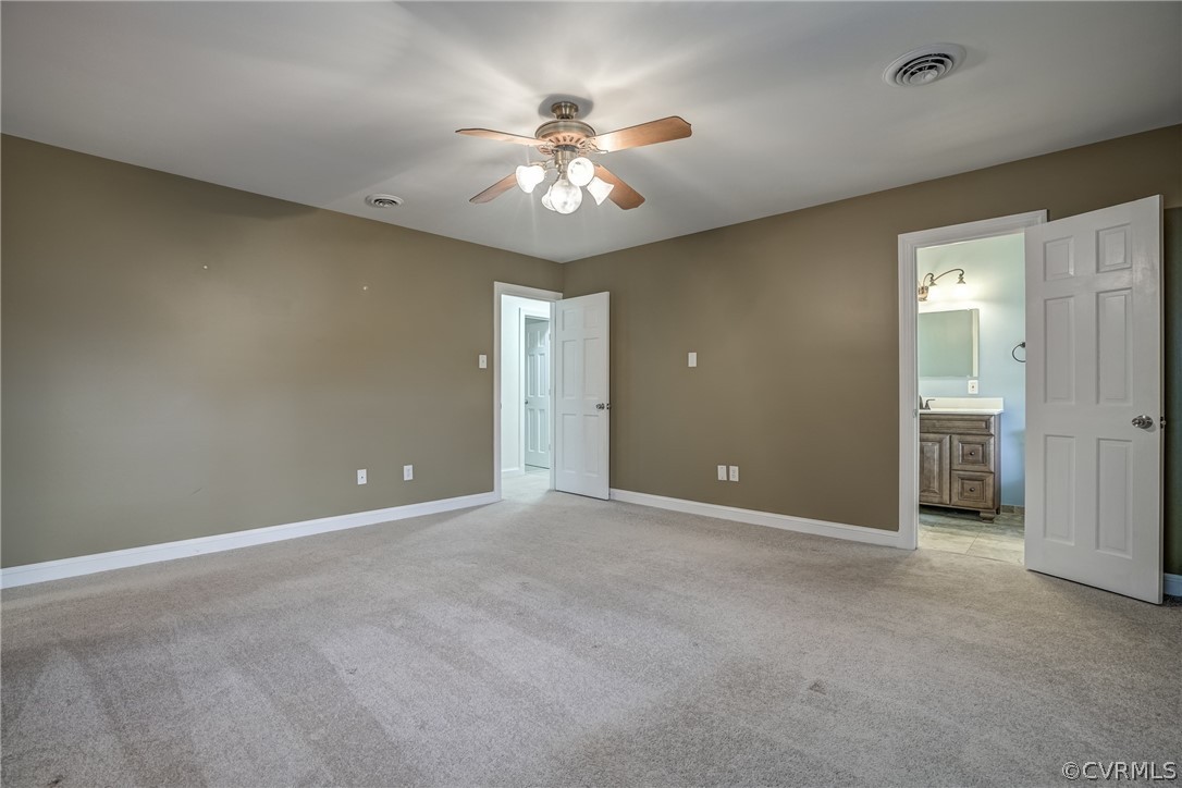 4051 Falstone Road Richmond, VA 23234 - Photo 40 of 50 an empty room with closet and a chandelier fan
