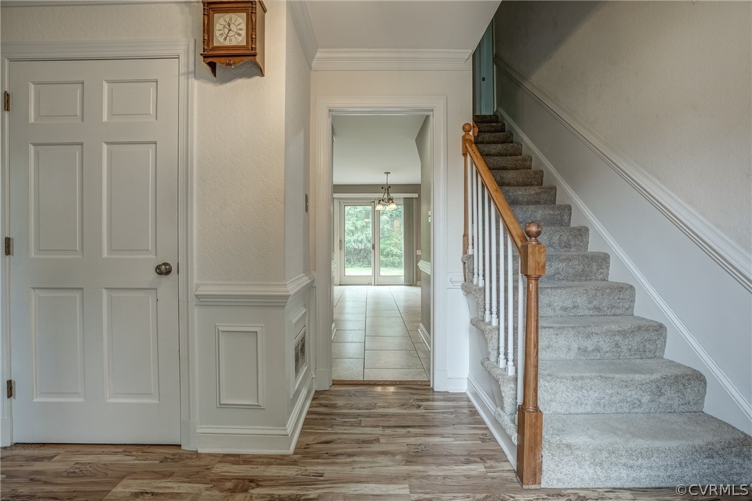 4051 Falstone Road Richmond, VA 23234 - Photo 4 of 50 a view of a hallway with wooden floor and staircase