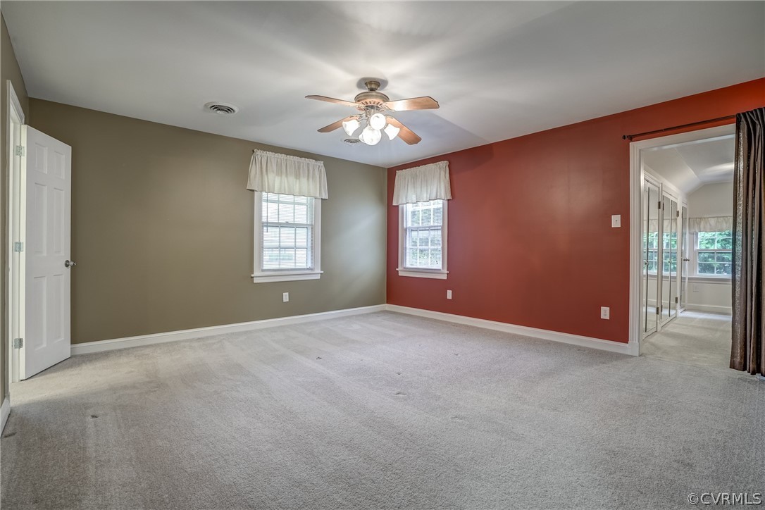 4051 Falstone Road Richmond, VA 23234 - Photo 41 of 50 an empty room with windows and fan