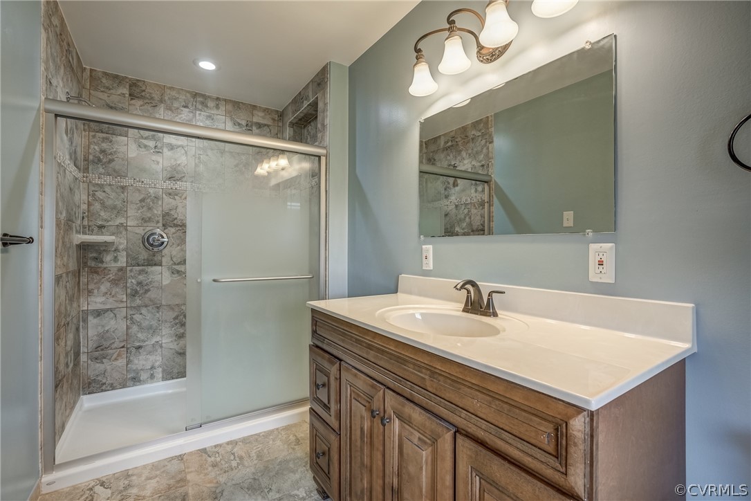 4051 Falstone Road Richmond, VA 23234 - Photo 43 of 50 a bathroom with a sink vanity and a mirror