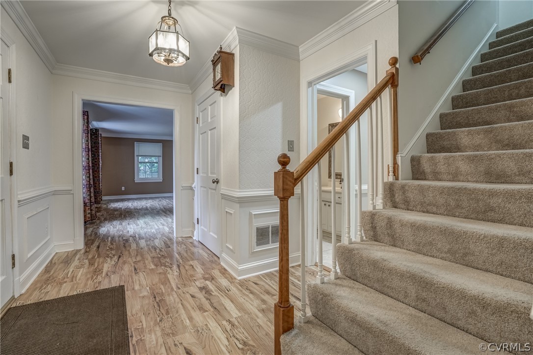 4051 Falstone Road Richmond, VA 23234 - Photo 5 of 50 a view of a livingroom with wooden floor and stairs