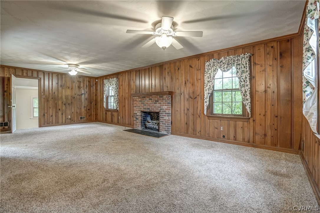 4051 Falstone Road Richmond, VA 23234 - Photo 7 of 50 an empty room with windows and fireplace