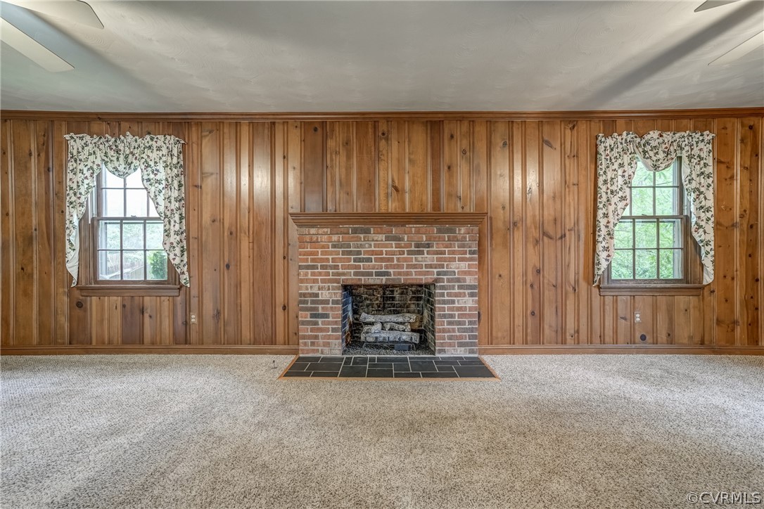 4051 Falstone Road Richmond, VA 23234 - Photo 9 of 50 an empty room with windows and fireplace