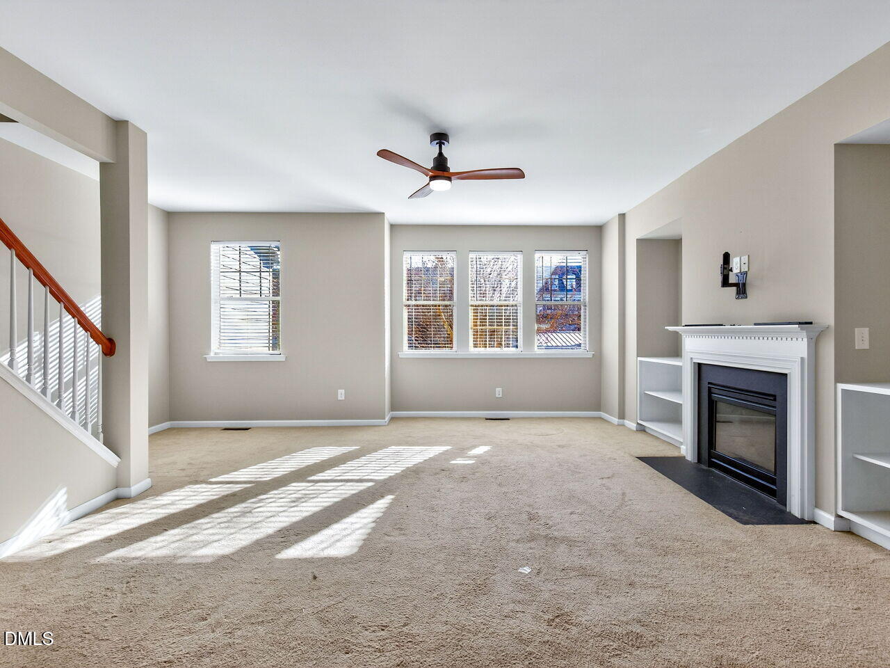 1308 Cornell Place Raleigh, NC 27607 - Photo 16 of 31 a view of an empty room with window and fireplace