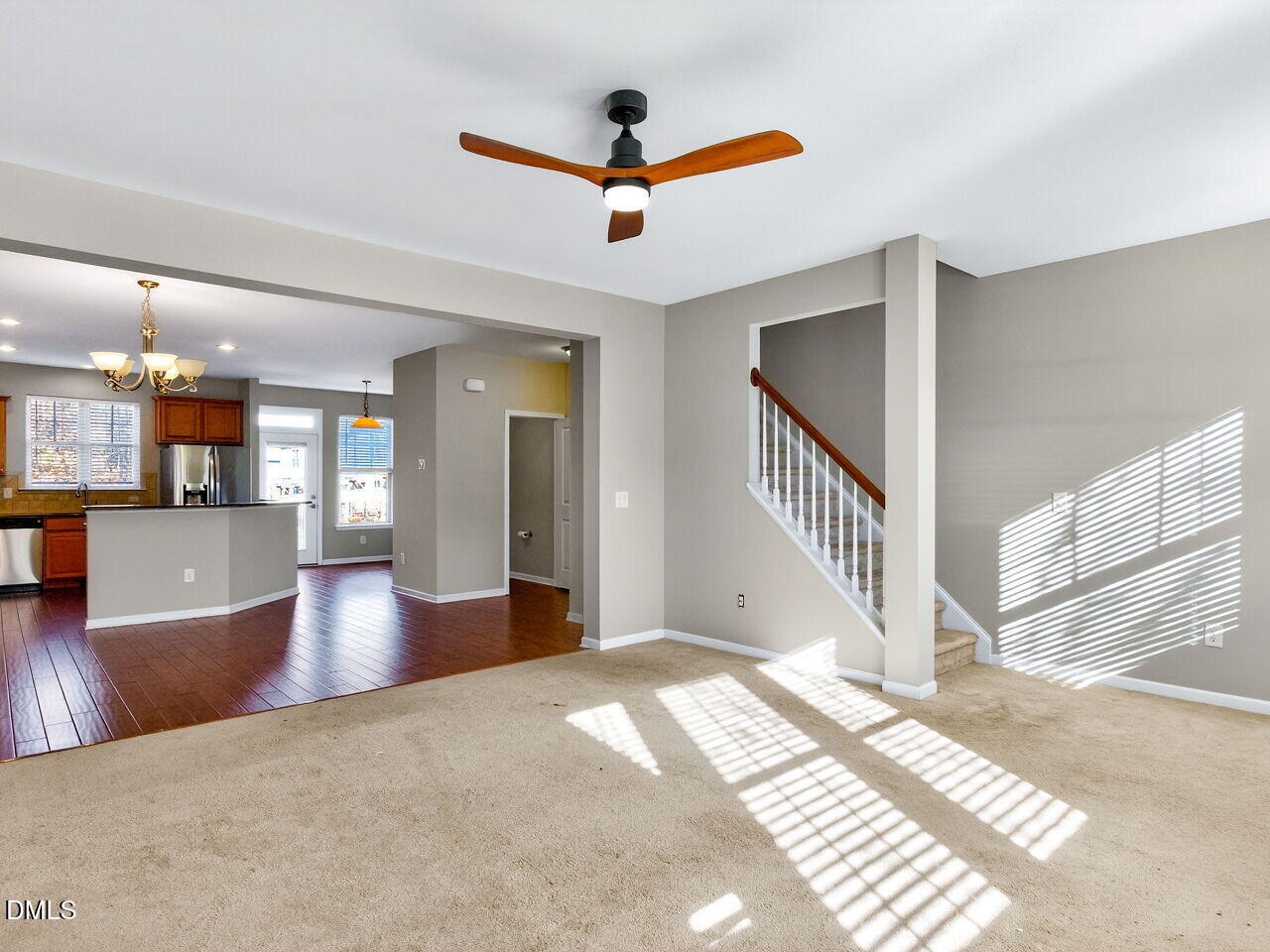 1308 Cornell Place Raleigh, NC 27607 - Photo 18 of 31 a view of a livingroom with wooden floor and a ceiling fan