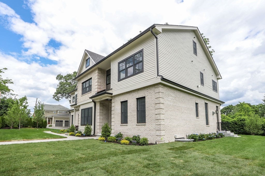 35 Mignon Road Newton, MA 02465 - Photo 2 of 42 a front view of a house with a yard
