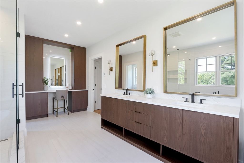 35 Mignon Road Newton, MA 02465 - Photo 23 of 42 a large bathroom with a double vanity sink mirror and bathtub
