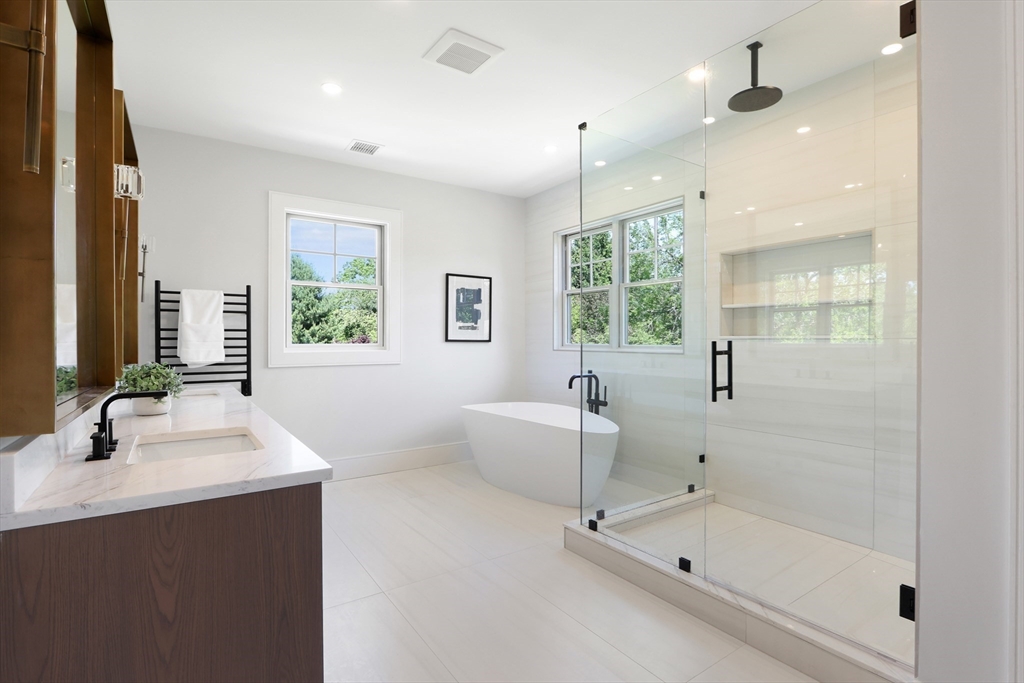 35 Mignon Road Newton, MA 02465 - Photo 24 of 42 a bathroom with a bathtub sink and mirror