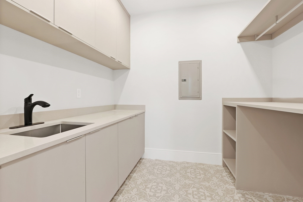 35 Mignon Road Newton, MA 02465 - Photo 26 of 42 a kitchen with a sink and cabinets
